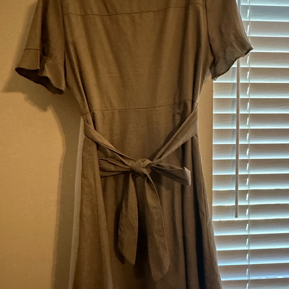 Super cute dress! Button up, approximately knee length or slightly shorter